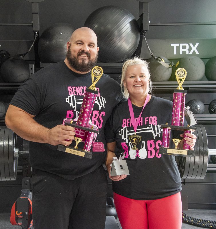 Nick Curl, left, lifted 455 pounds, while Dawn Snyder lifted 155 pounds.